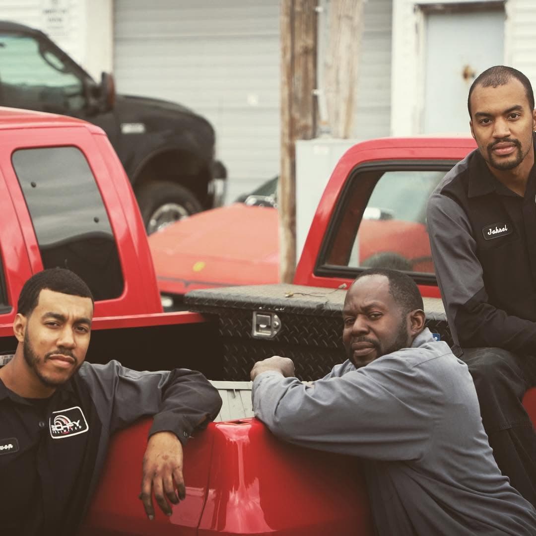 The Sci-Fy Unlimited crew with a red diesel pickup